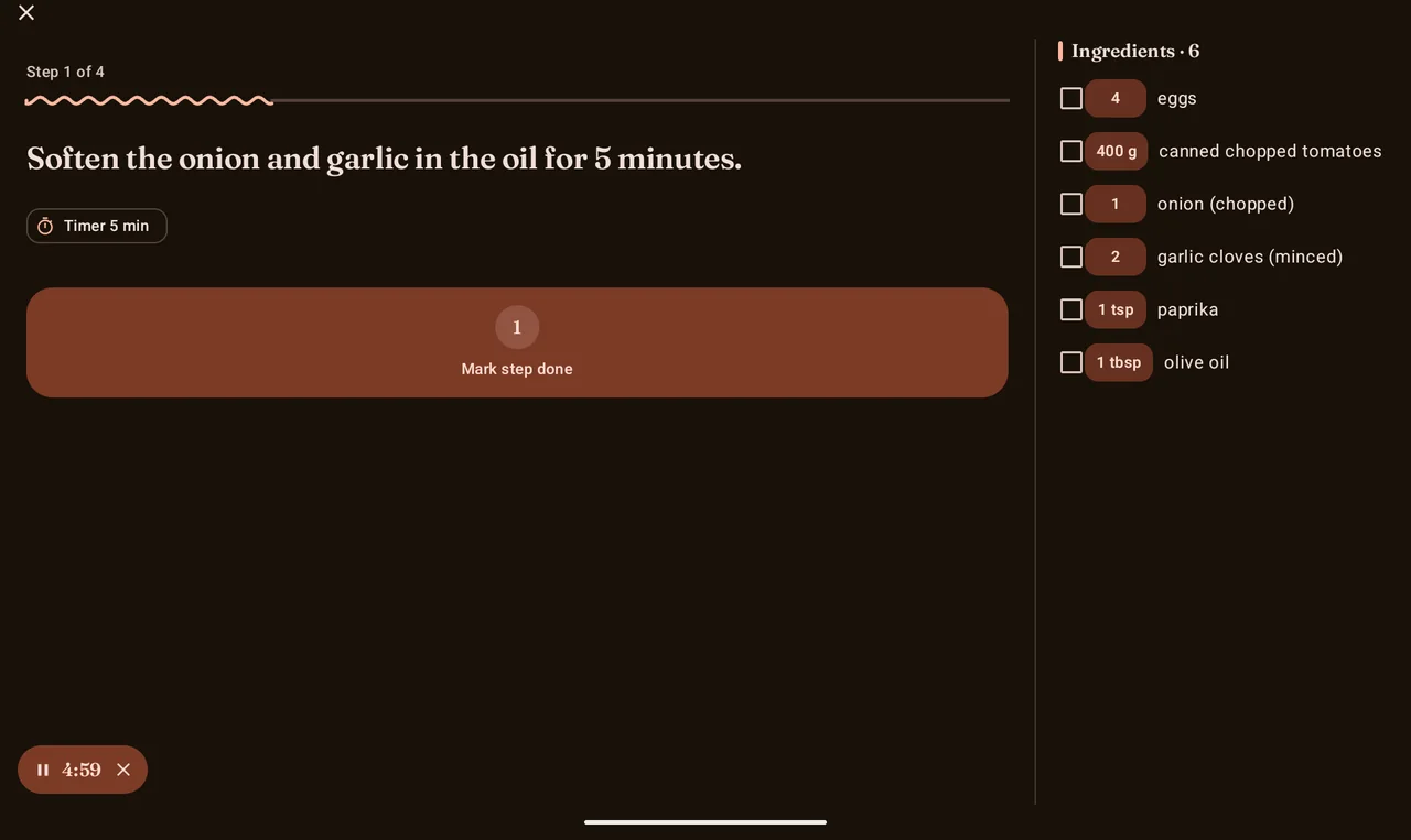 Cook mode on a tablet in landscape, showing the current step with a running timer and a permanent ingredients checklist on the right